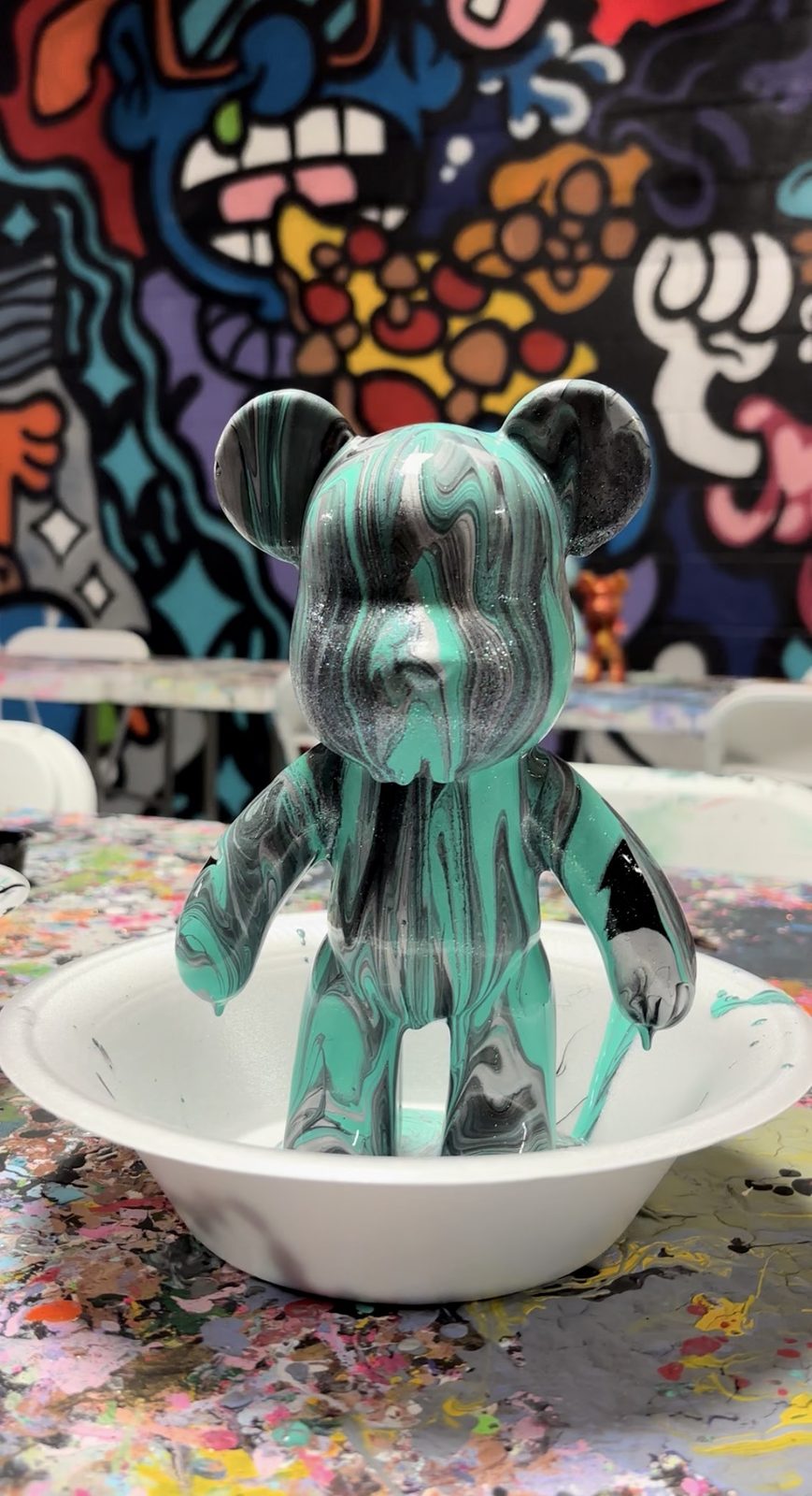 Teal and black swirled bear
